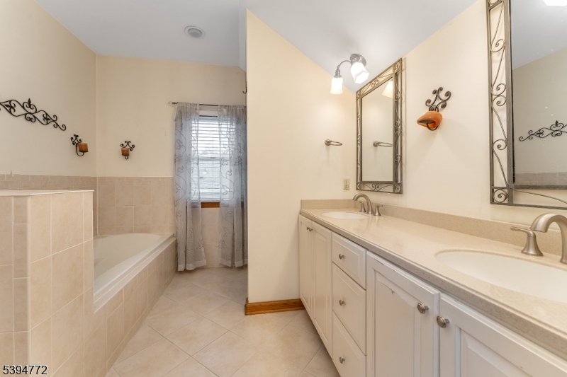 22 Fairview Avenue Clinton, NJ 08809 - Photo 20 of 31 a bathroom with a tub sink and mirror