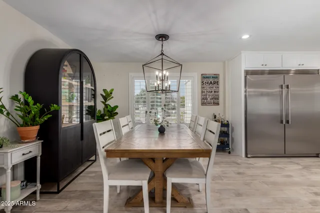 a bedroom with a bed and a table in it