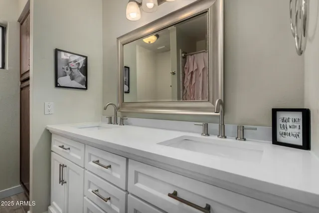 a backyard of a house with a garden and outdoor seating