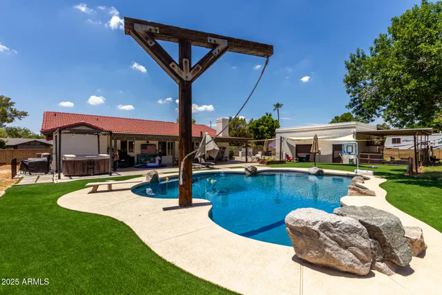 an aerial view of residential houses with outdoor space