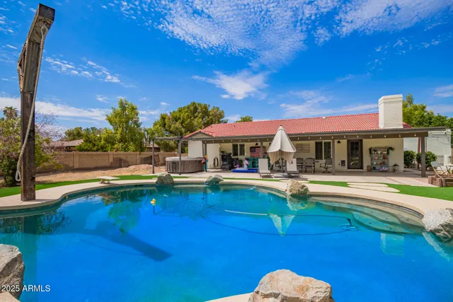 an aerial view of a residential houses with outdoor space