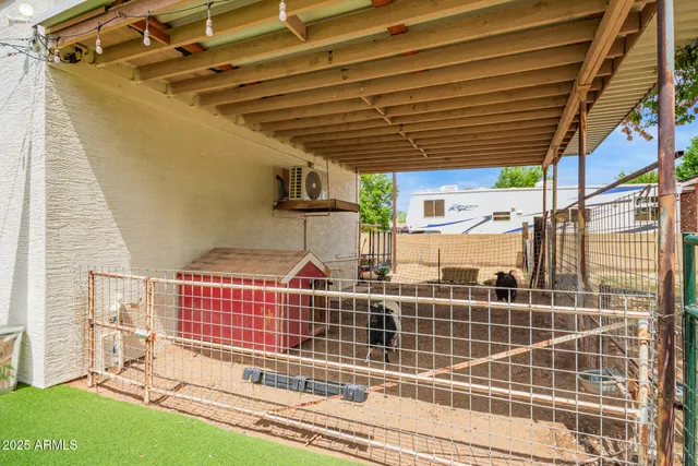 an aerial view of a residential houses with yard
