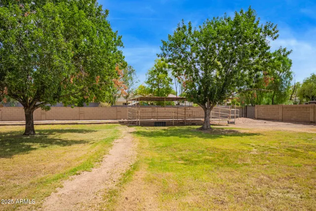 an aerial view of residential house with swimming pool and outdoor space