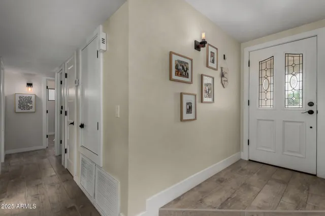 a view of a hallway with bathroom