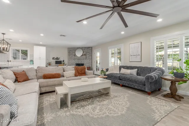 a bedroom with a large bed and a couch