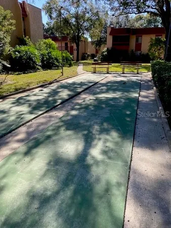 a view of swimming pool with a yard
