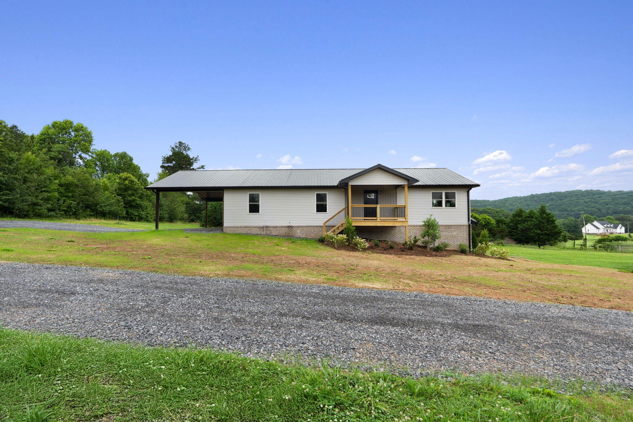 2517 No Pone Road Northwest Georgetown, TN 37336 - Photo 3 of 41 a front view of a house with a yard and porch