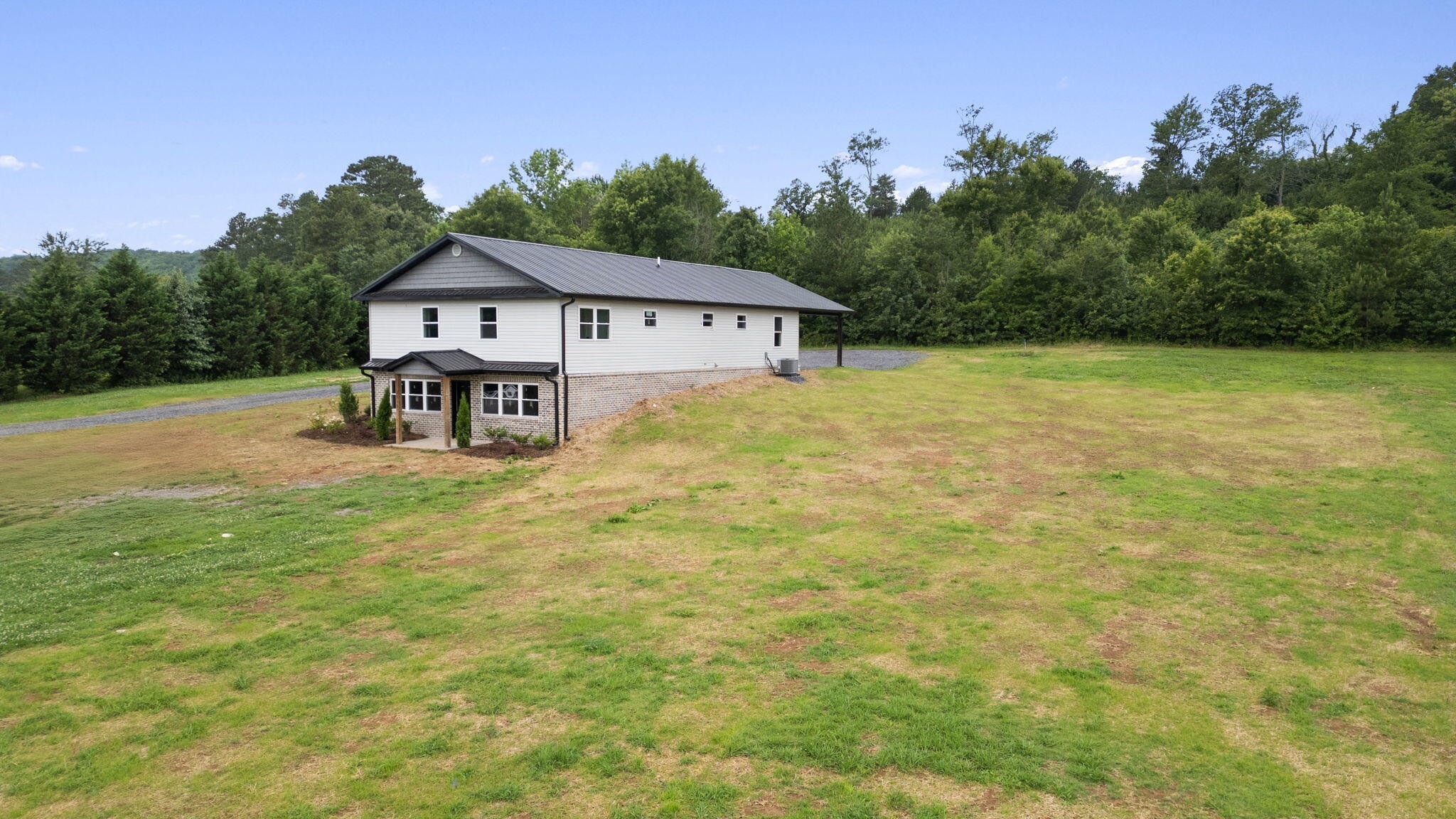 2517 No Pone Road Northwest Georgetown, TN 37336 - Photo 8 of 41 a house with green field in front of it