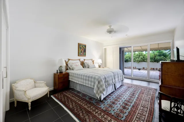 a bedroom with a bed and a couch