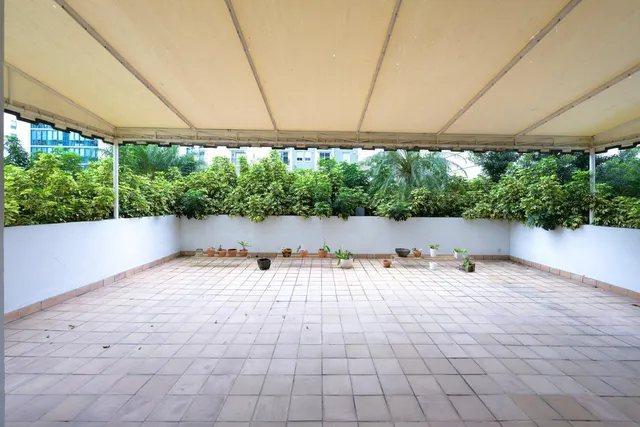 a view of a room with furniture and a window