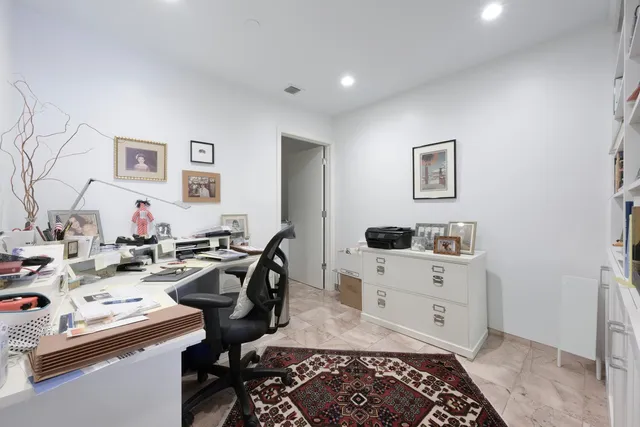 a view of a workspace with furniture