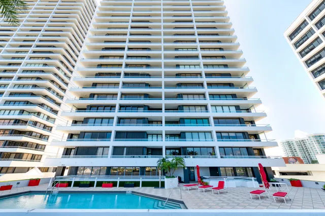 a living room with furniture and flowers