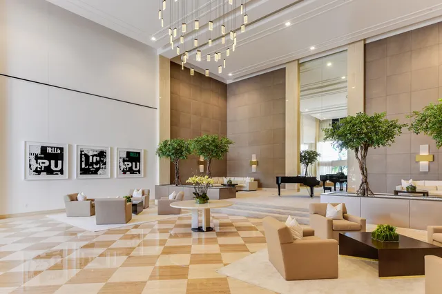 a living room with furniture and flowers