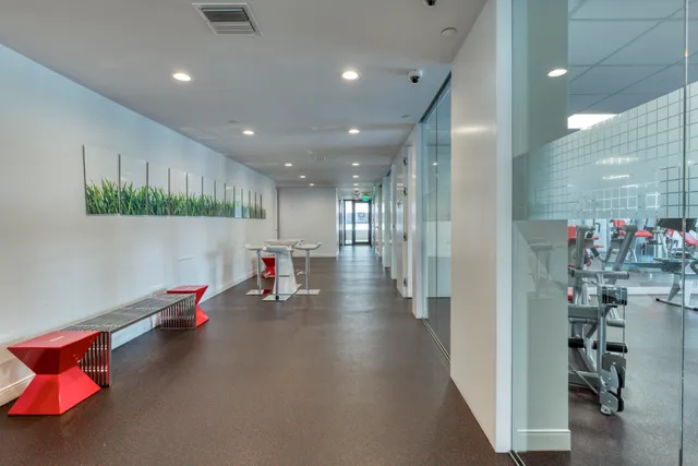 an outdoor space with swimming pool and furniture