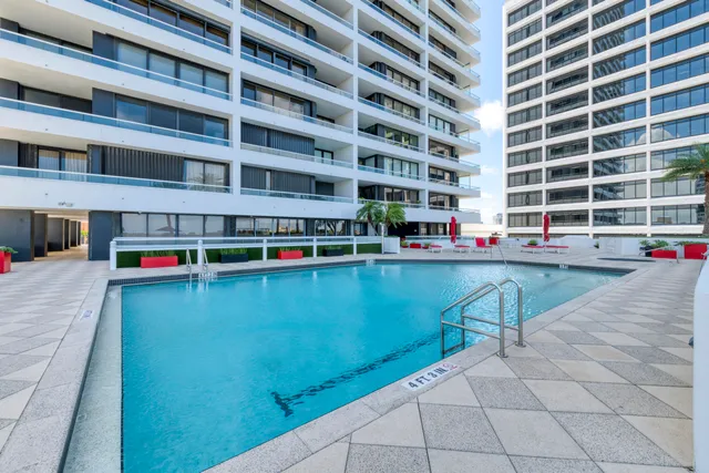 a view of swimming pool with outdoor seating