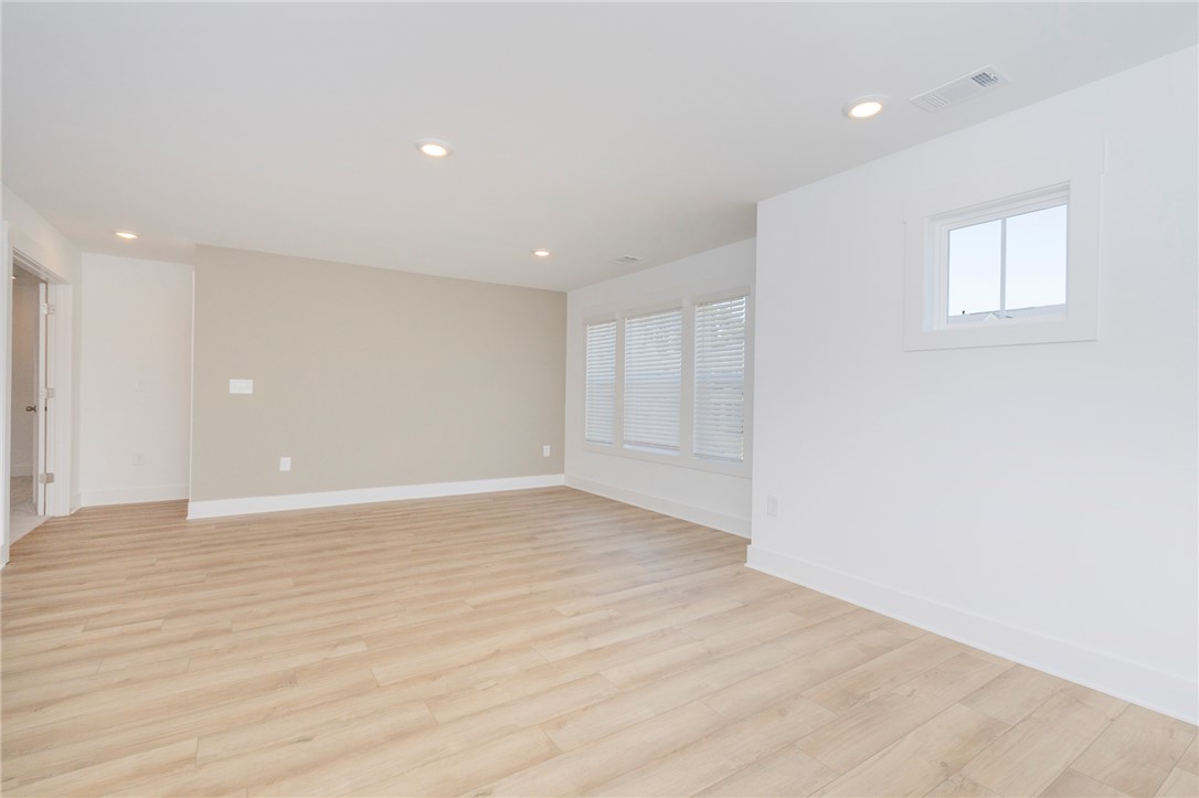 607 WH Kay Lane Anderson, SC 29621 - Photo 19 of 48 Recessed lighting illuminates the smooth, light wood-look flooring throughout this adaptable living area.