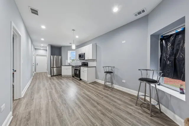 a bedroom with a bed and a couch