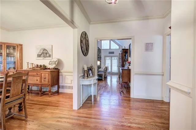 a view of living room filled with furniture and wooden floor