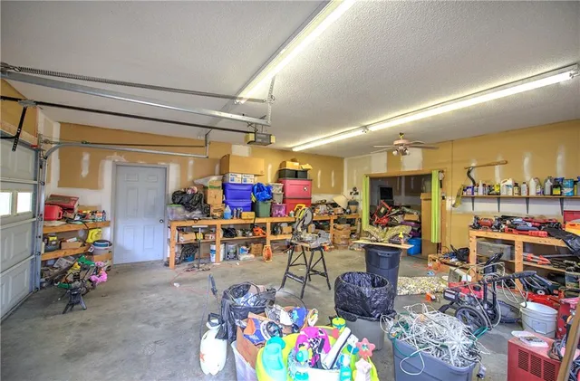 a view of a house with large space and a car parked in front of it