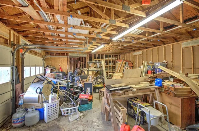 a view of a house with a yard and wooden fence