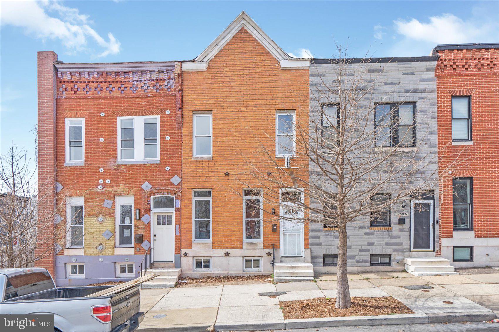 a front view of a building with street view