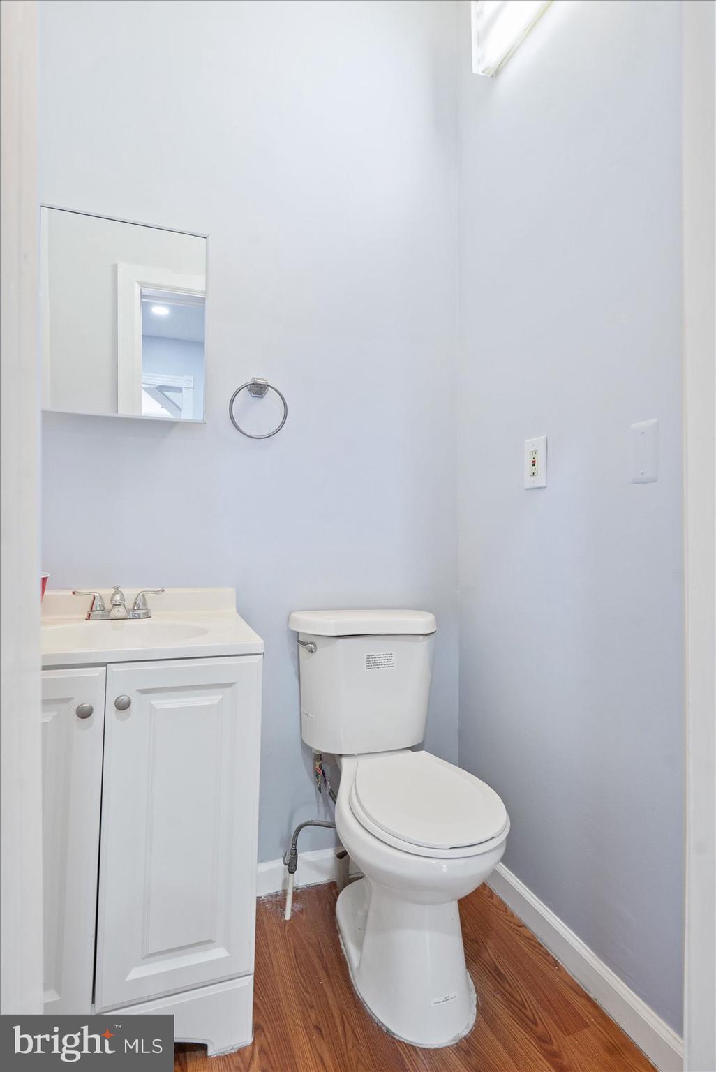 1604 North Broadway Baltimore, MD 21213 - Photo 14 of 39 a white toilet sitting next to a bathroom sink