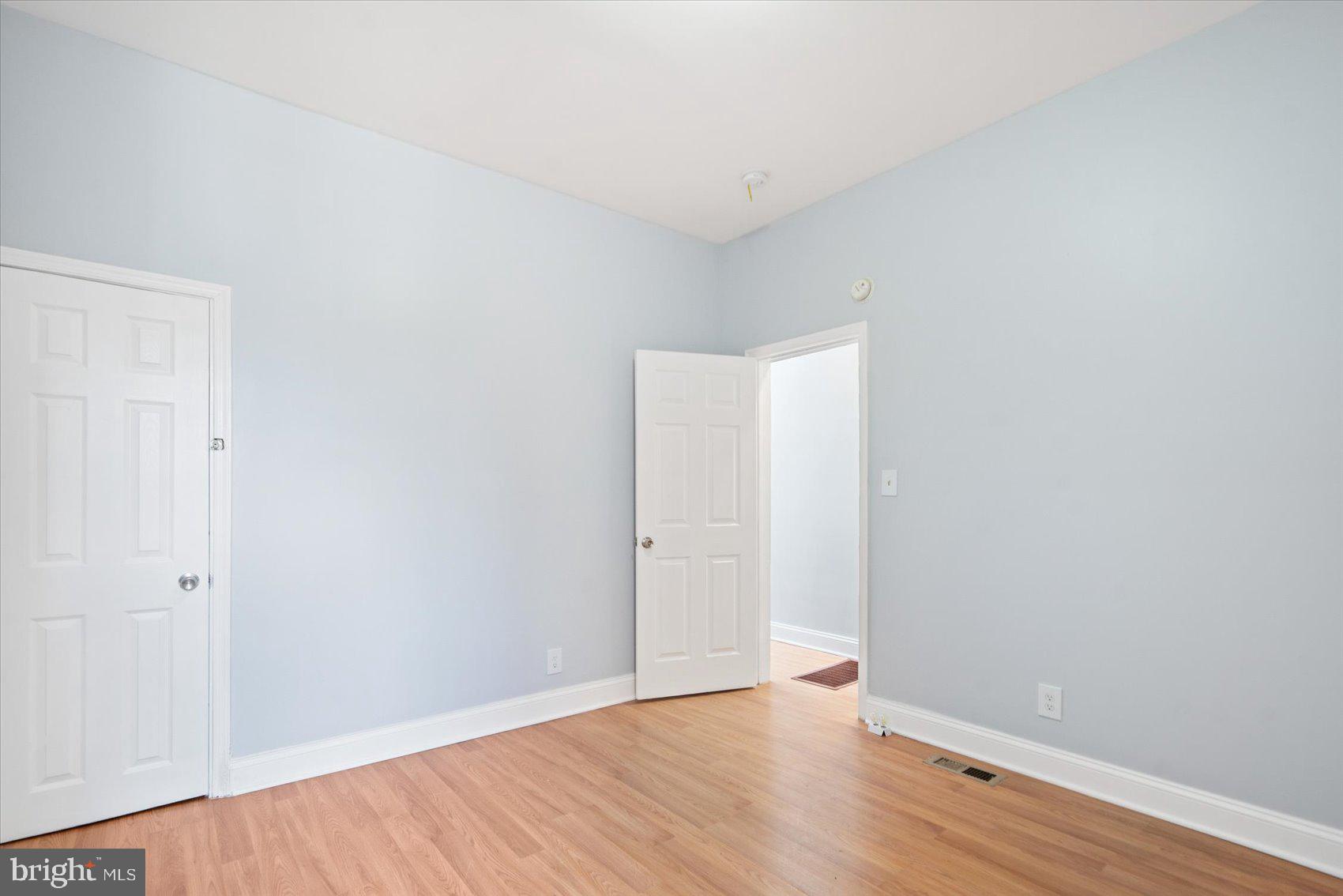 1604 North Broadway Baltimore, MD 21213 - Photo 23 of 39 a view of an empty room with wooden floor