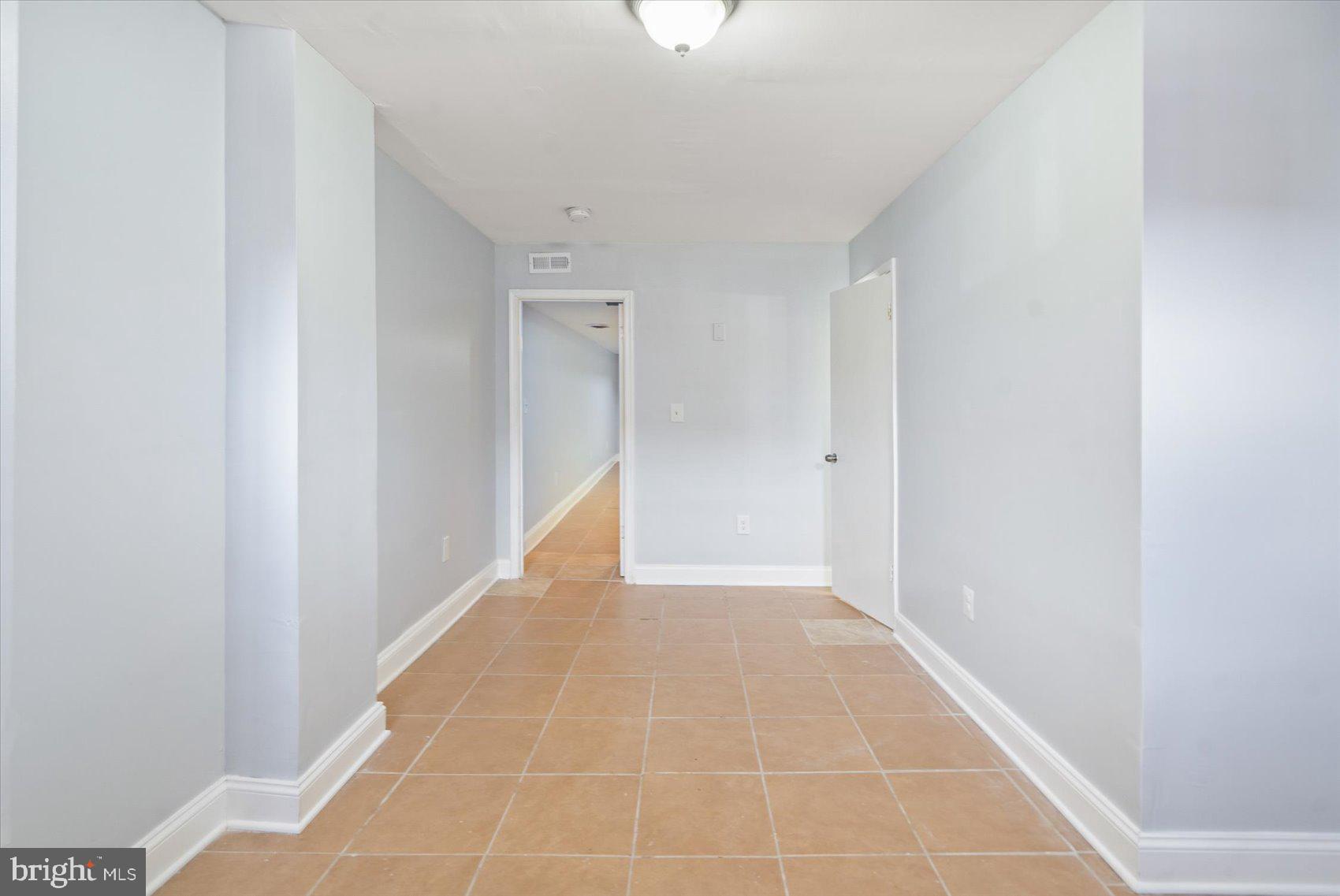1604 North Broadway Baltimore, MD 21213 - Photo 36 of 39 a view of an empty room with windows