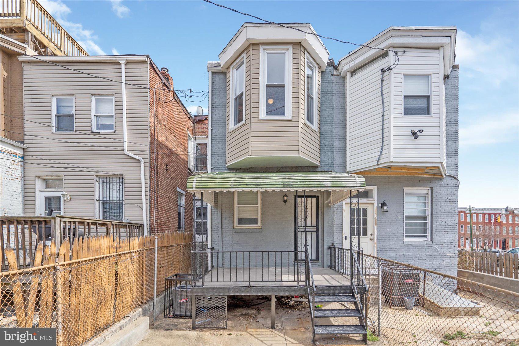 1604 North Broadway Baltimore, MD 21213 - Photo 38 of 39 a front view of a house with a porch