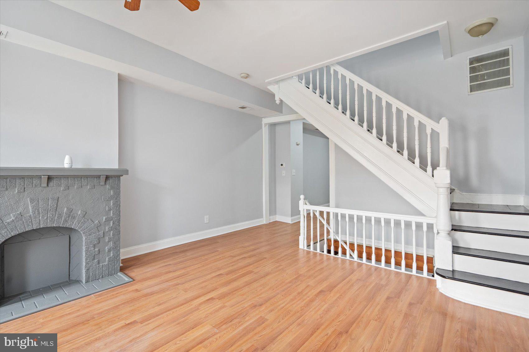 1604 North Broadway Baltimore, MD 21213 - Photo 8 of 39 a view of livingroom with furniture and fireplace