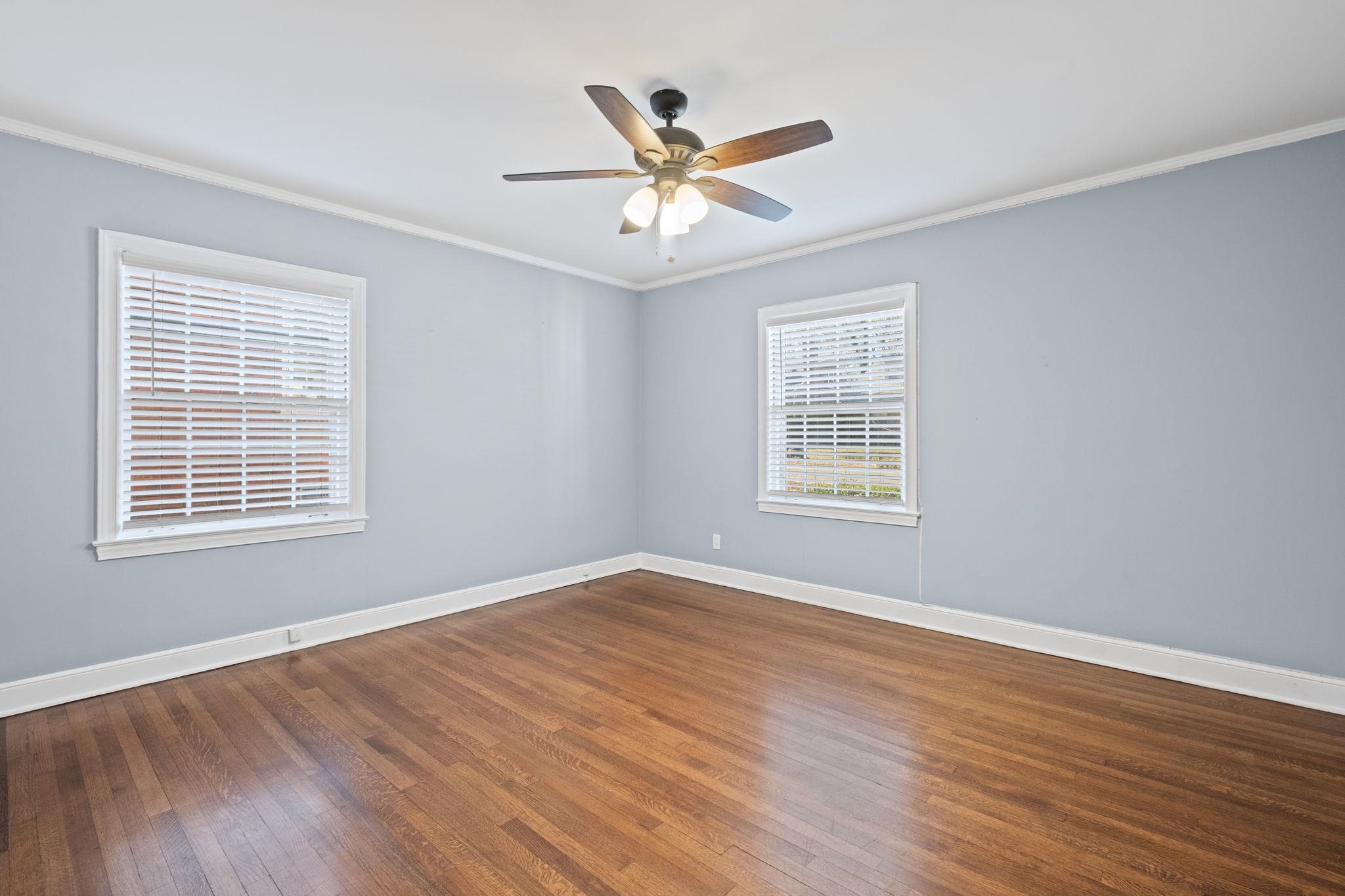 88 North Reese Street Memphis, TN 38111 - Photo 23 of 40 a view of an empty room with wooden floor and a window