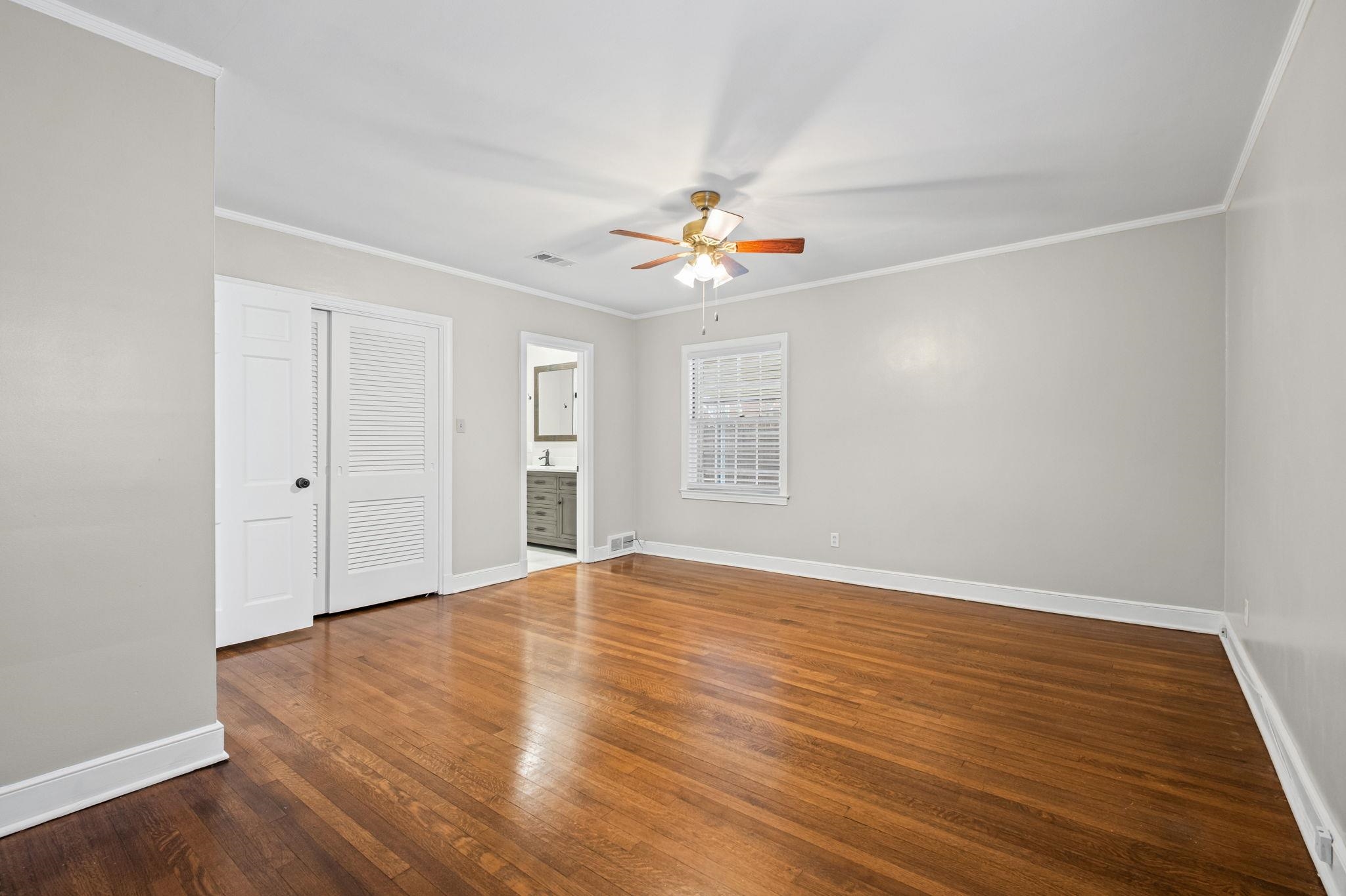 88 North Reese Street Memphis, TN 38111 - Photo 26 of 40 an empty room with wooden floor and windows