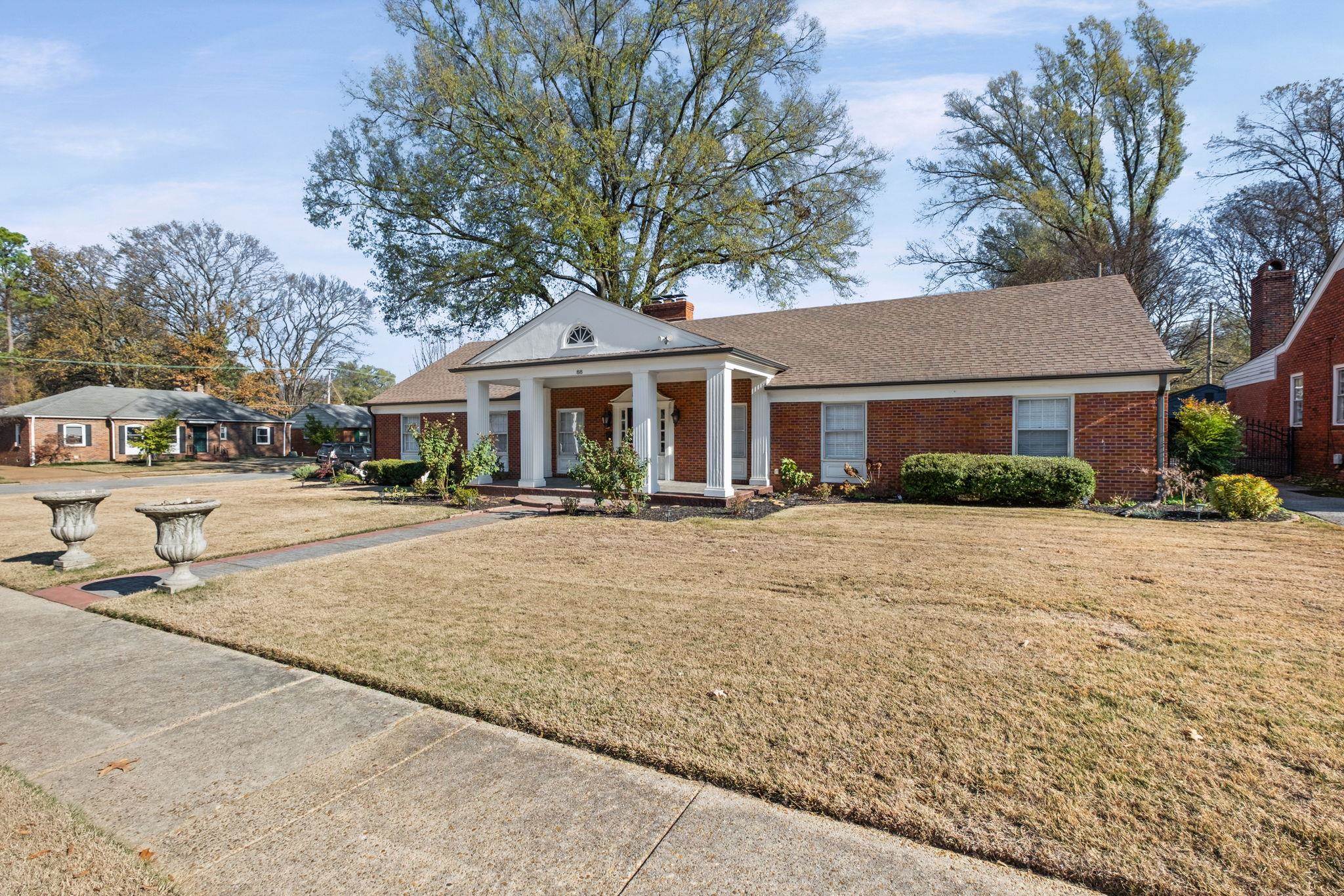 88 North Reese Street Memphis, TN 38111 - Photo 3 of 40 a front view of a building with a garden and trees