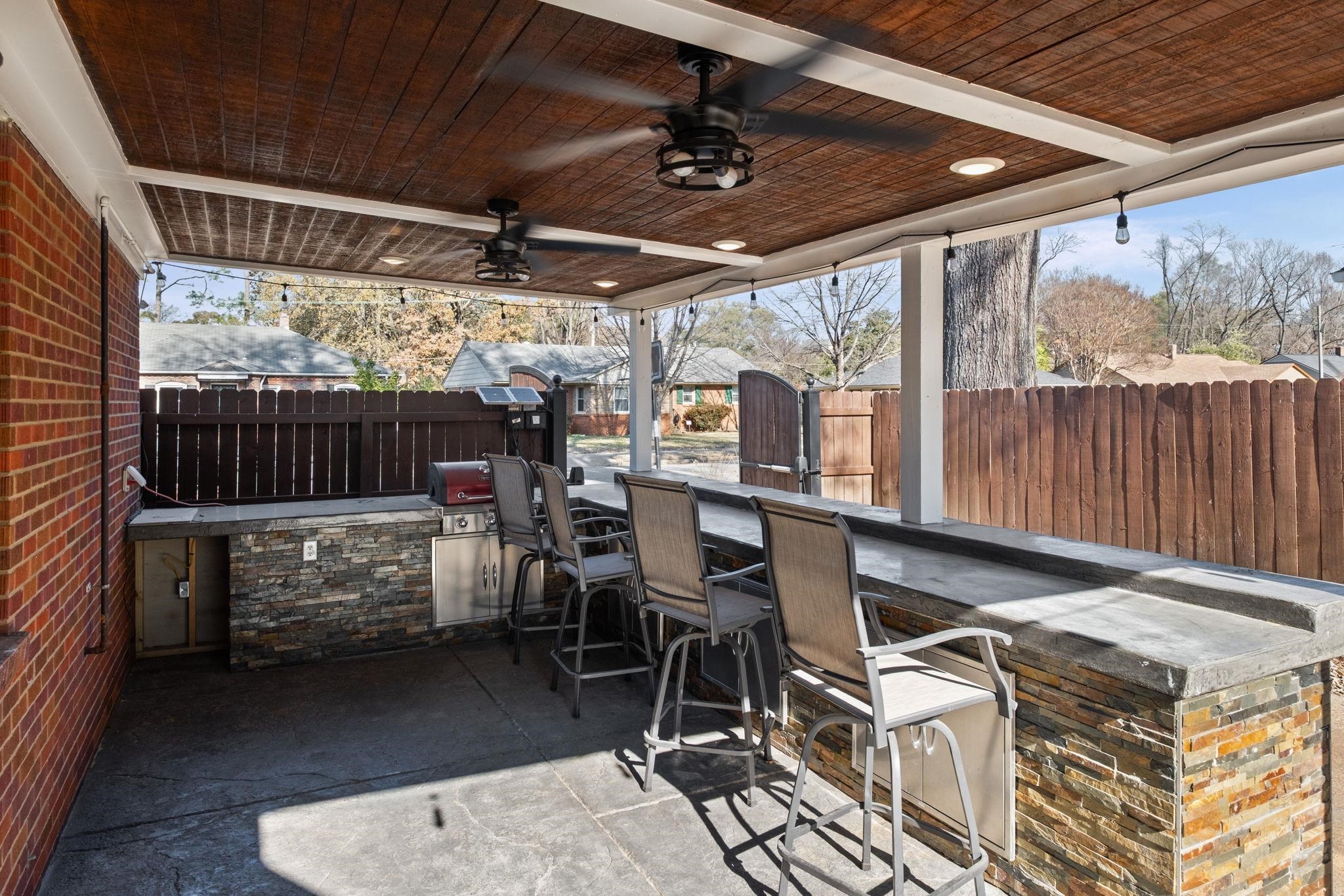 88 North Reese Street Memphis, TN 38111 - Photo 34 of 40 a view of a patio with a table chairs and a barbeque