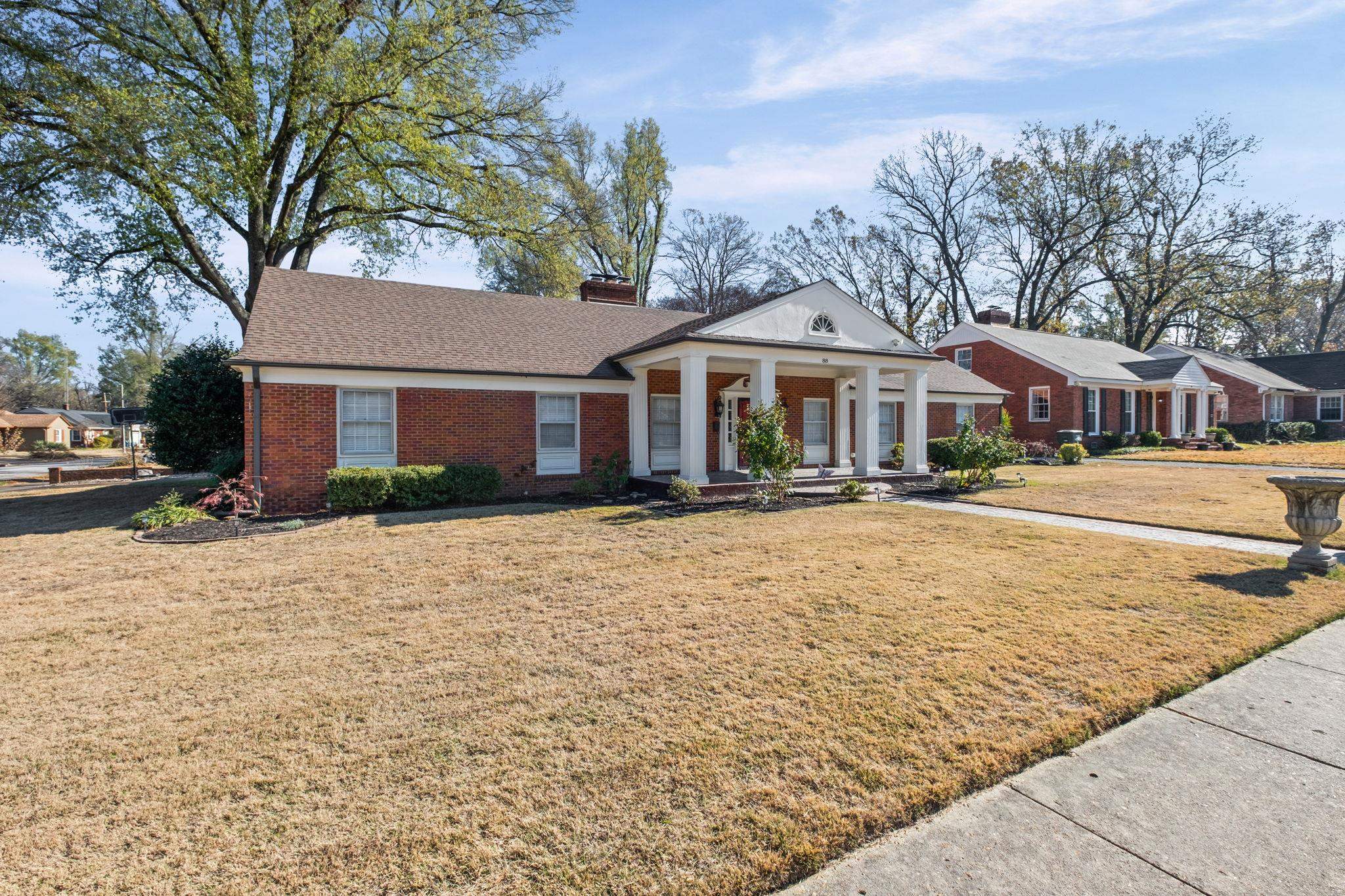 88 North Reese Street Memphis, TN 38111 - Photo 4 of 40 a front view of a house with a yard and large trees