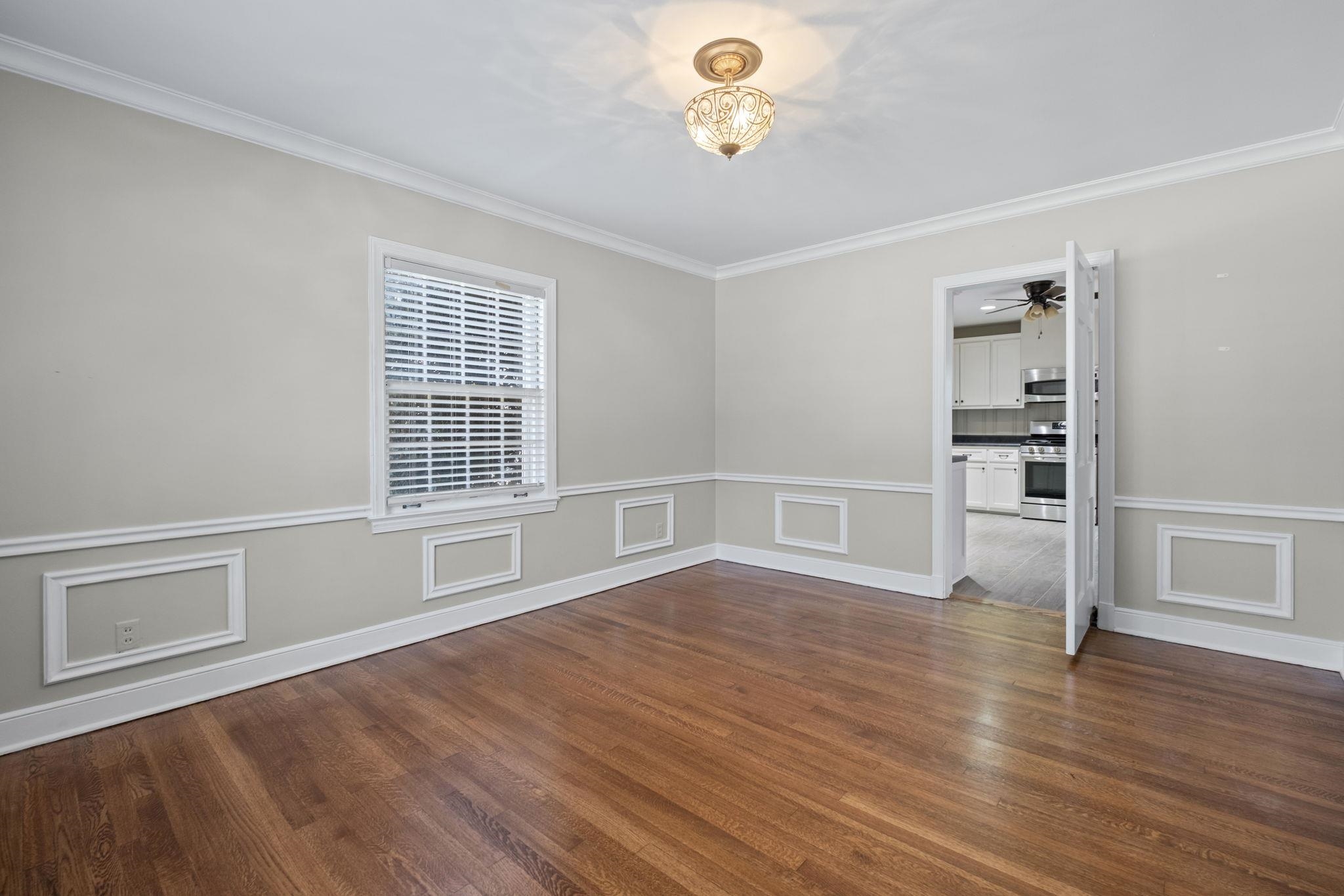 88 North Reese Street Memphis, TN 38111 - Photo 10 of 40 an empty room with wooden floor and windows