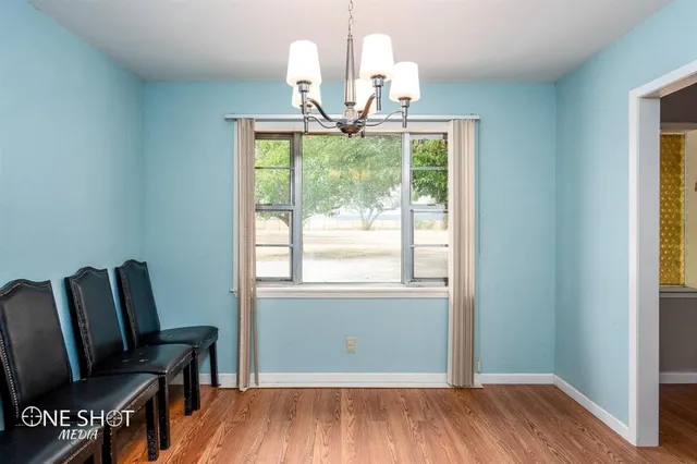 a view of a livingroom with furniture and wooden floor