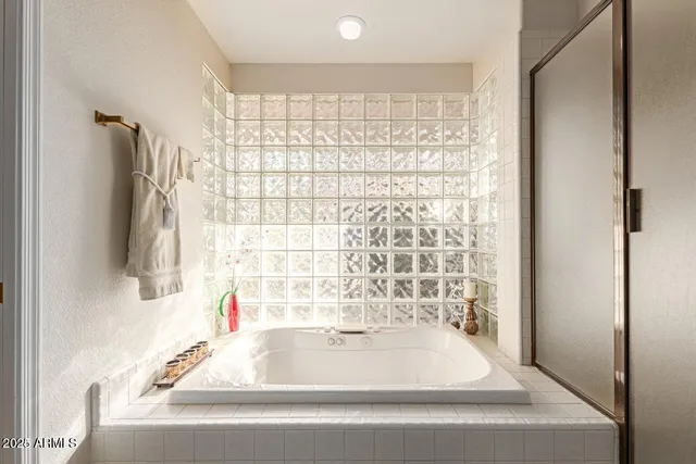 a bathroom with a bathtub and shower