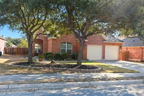 a house that has a tree in front of it