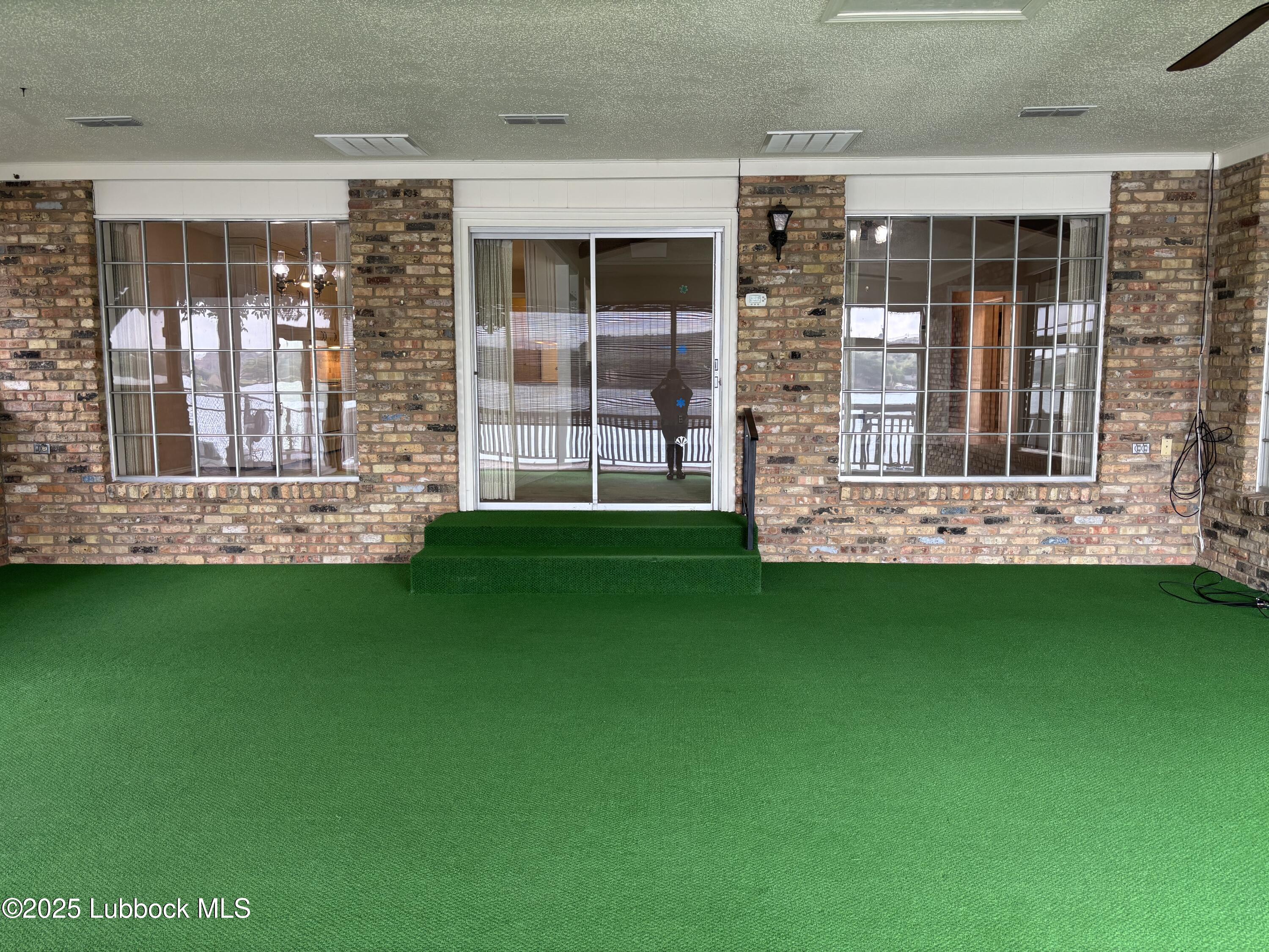 53 East Lakeshore Drive Ransom Canyon, TX 79366 - Photo 14 of 43 a front view of a house with a garden