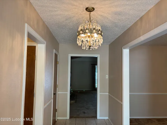 a kitchen with stainless steel appliances granite countertop a refrigerator a stove and a sink