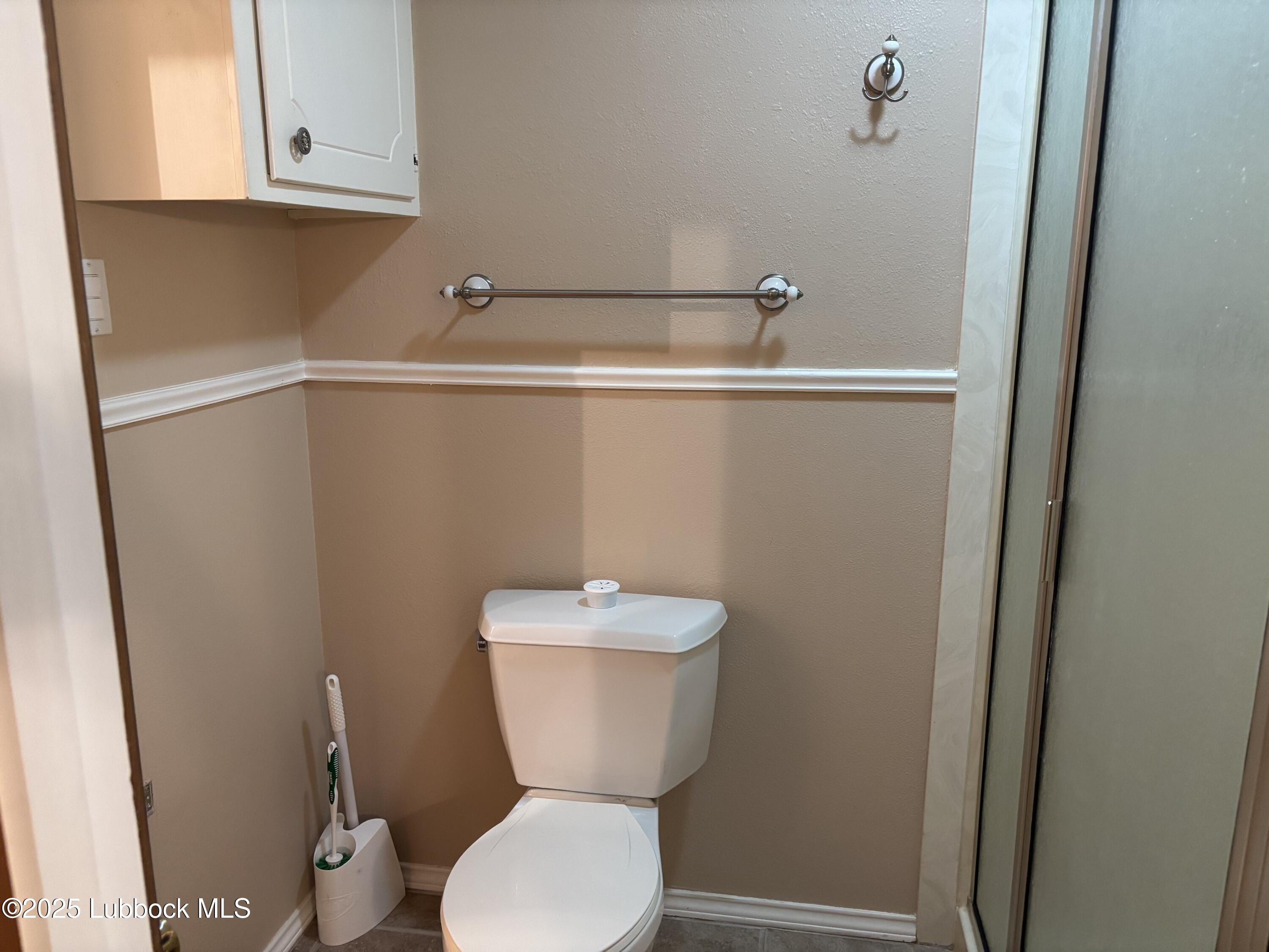 53 East Lakeshore Drive Ransom Canyon, TX 79366 - Photo 36 of 43 a bathroom with a toilet