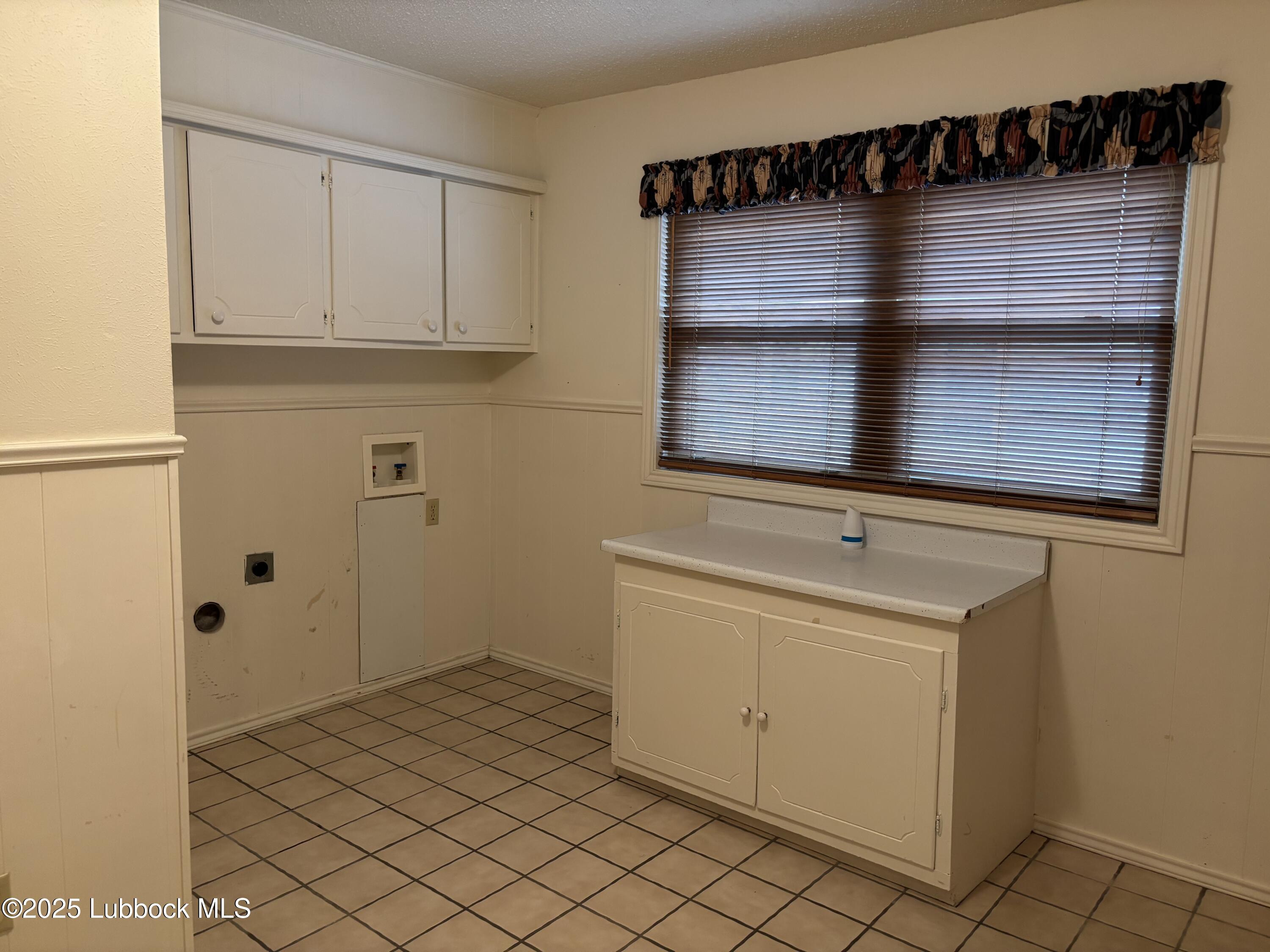 53 East Lakeshore Drive Ransom Canyon, TX 79366 - Photo 42 of 43 a bathroom with a shower and cabinets
