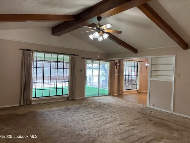 a view of an empty room with a sliding door