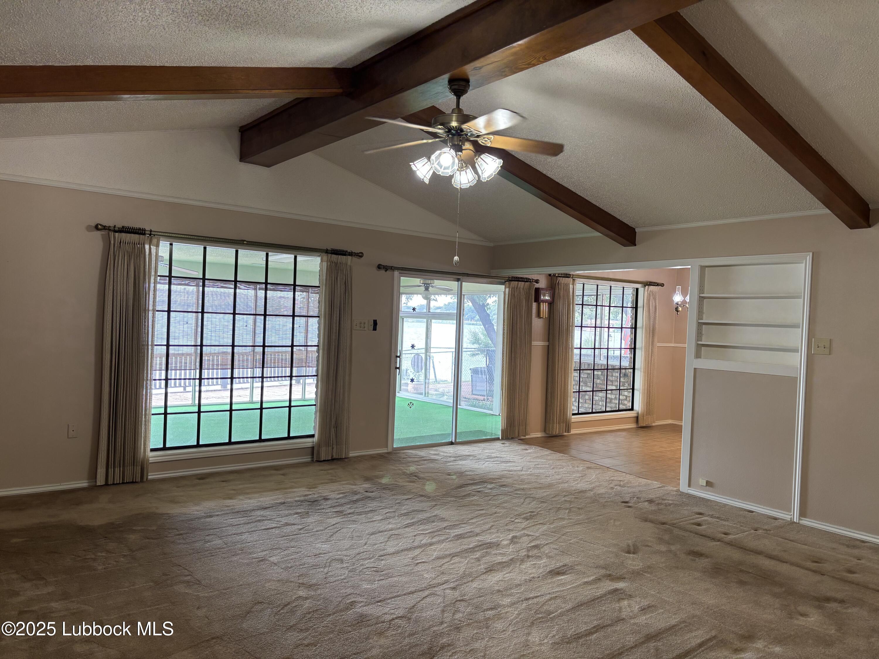 53 East Lakeshore Drive Ransom Canyon, TX 79366 - Photo 8 of 43 a view of an empty room with a window