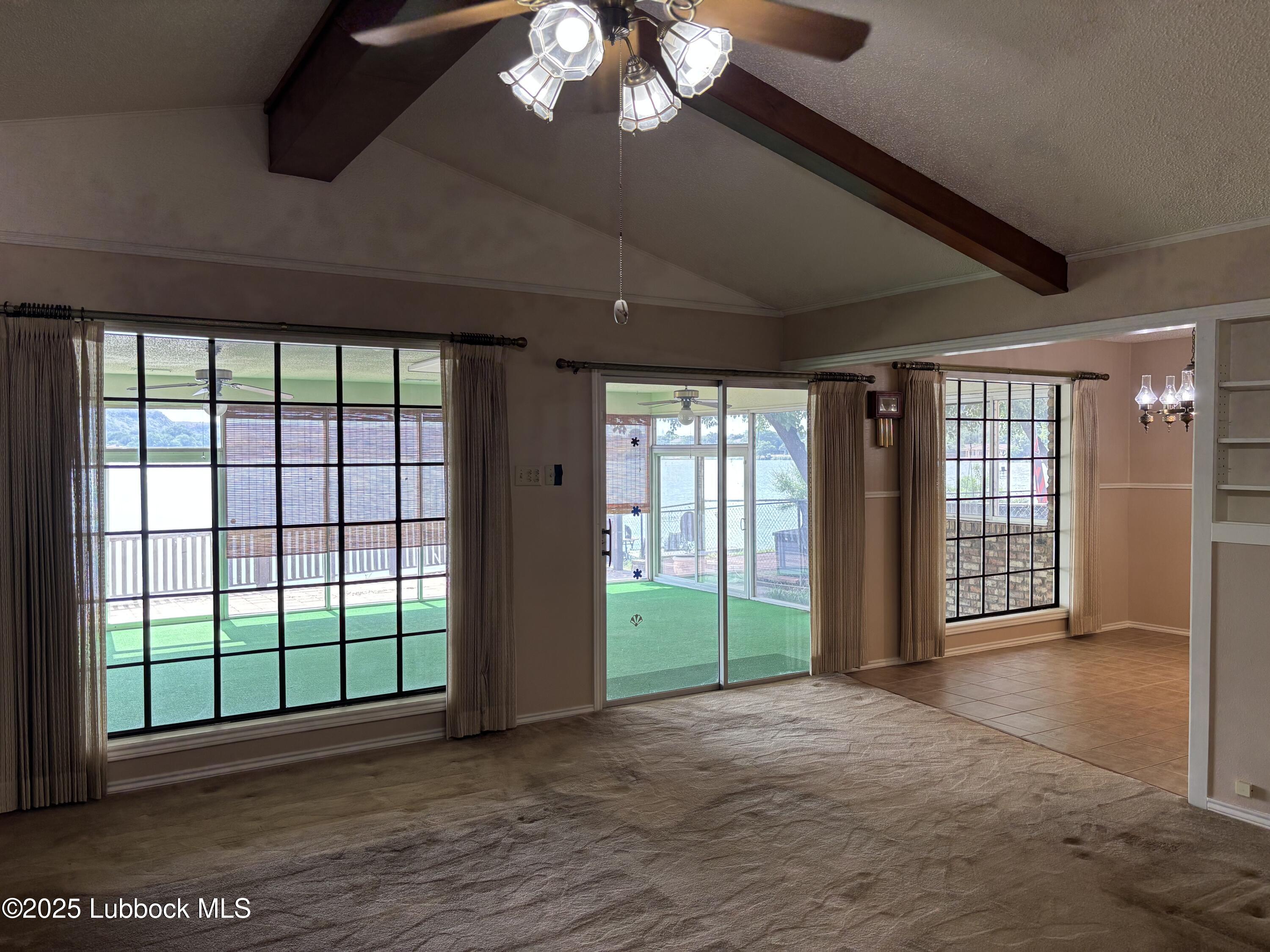 53 East Lakeshore Drive Ransom Canyon, TX 79366 - Photo 9 of 43 a view of an empty room with a sliding door