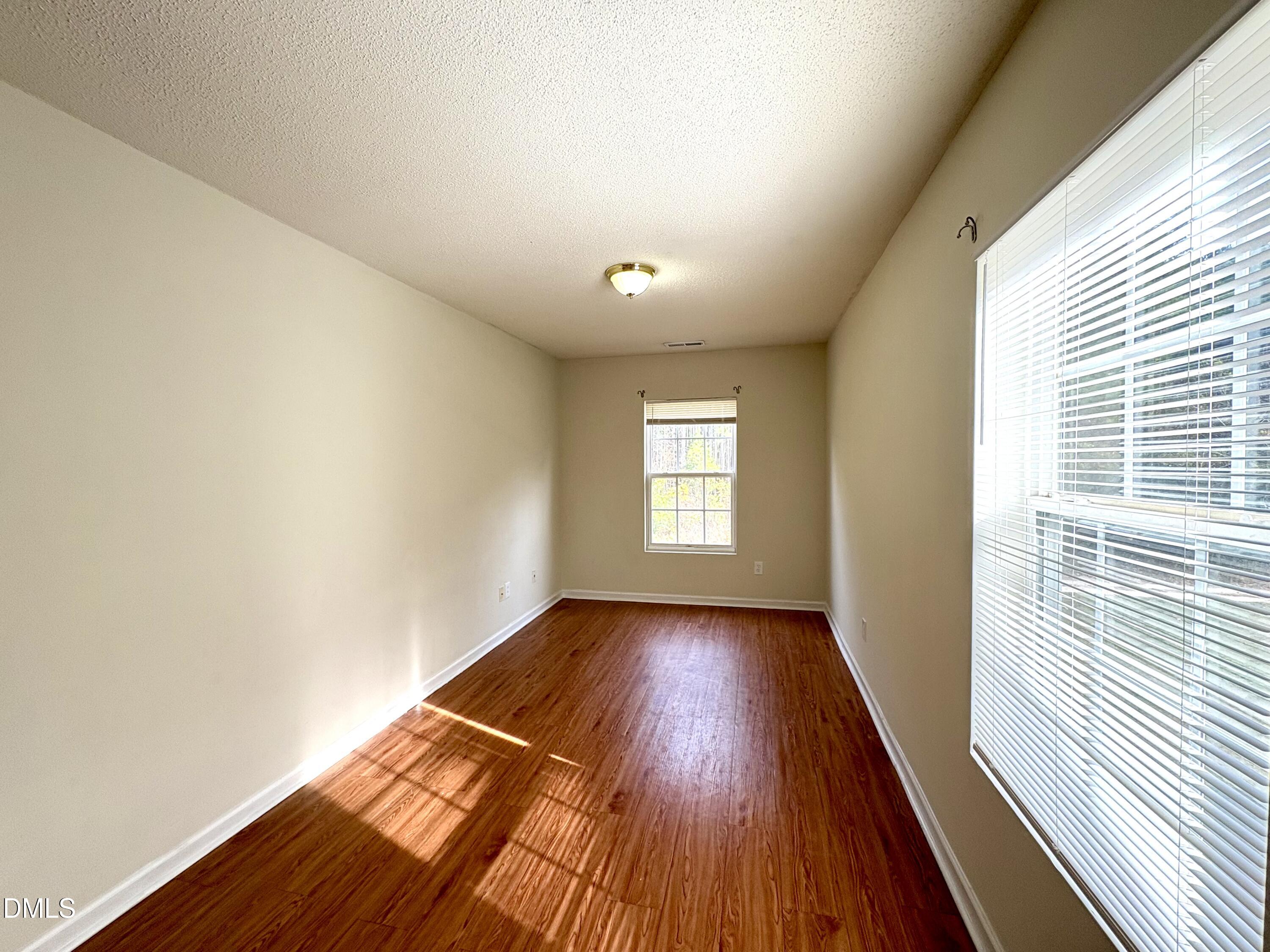 2422 Quarry Ridge Lane Raleigh, NC 27610 - Photo 9 of 10 a view of a room with wooden floor and window