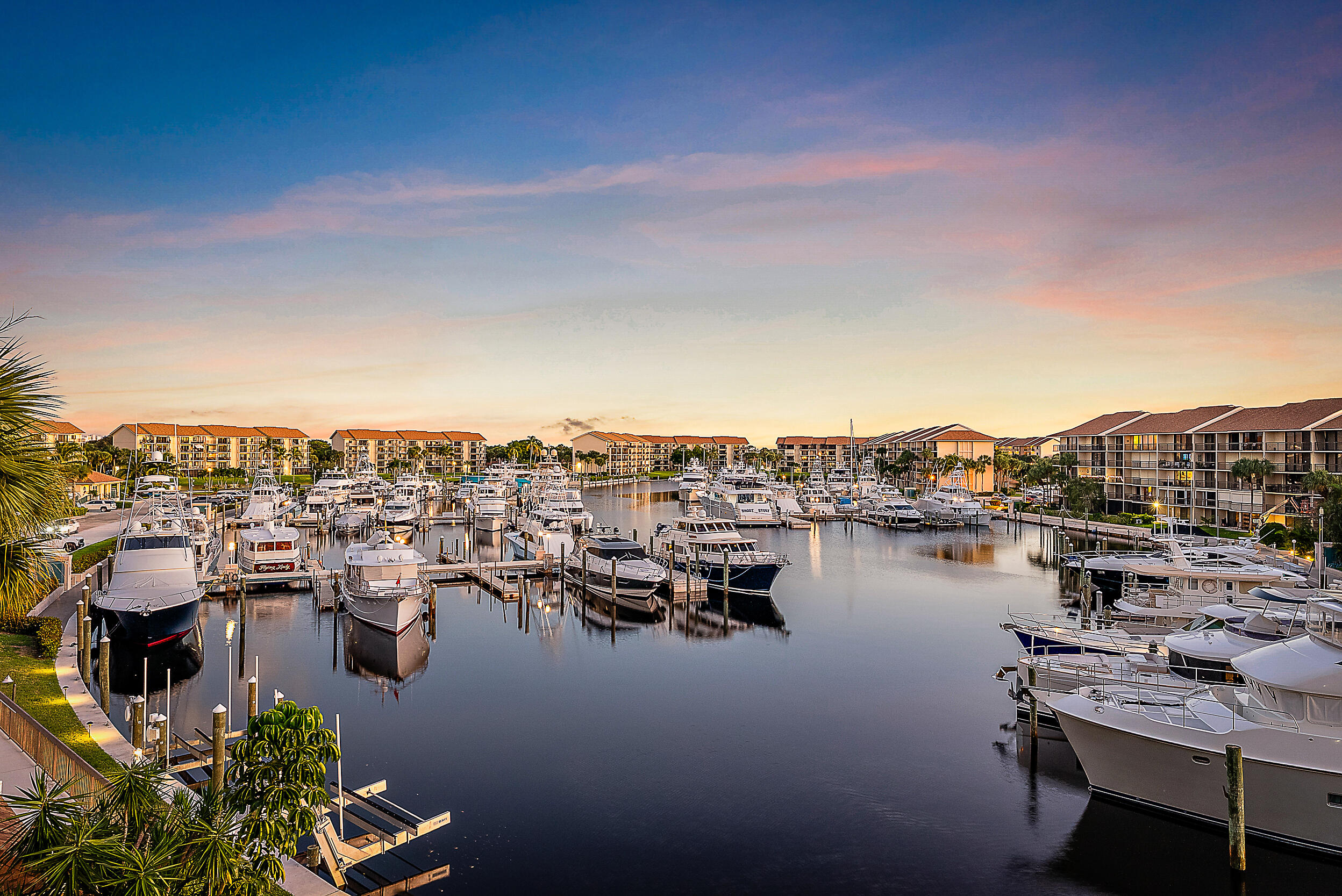 1601 Marina Isle Way, Unit 402 Jupiter, FL 33477 - Photo 17 of 37 Sunset View from Living Room Porch