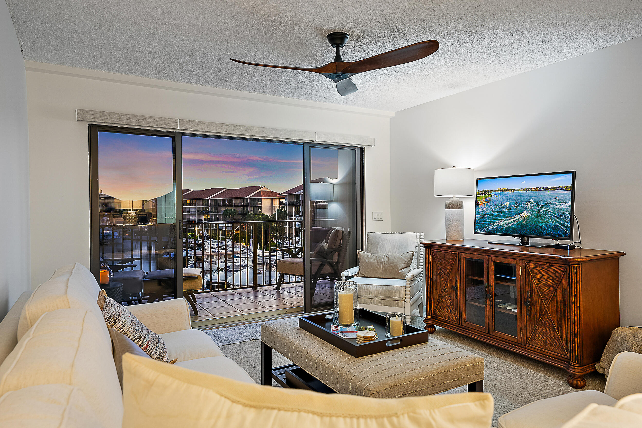 1601 Marina Isle Way, Unit 402 Jupiter, FL 33477 - Photo 4 of 37 Sunset View from Living Room