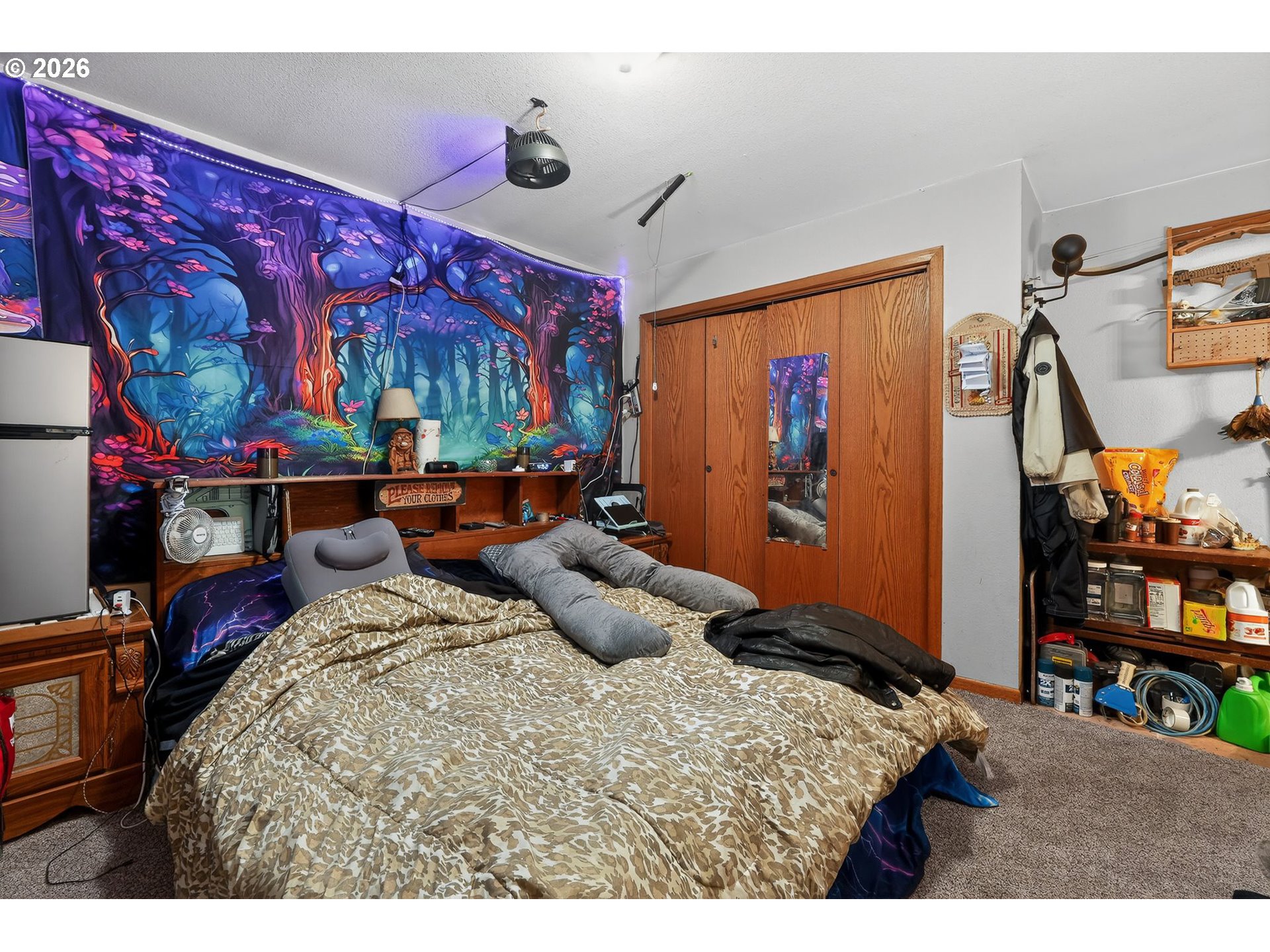 92981 Prairie Road Junction City, OR 97448 - Photo 13 of 29 a bed room with a bed and a tv